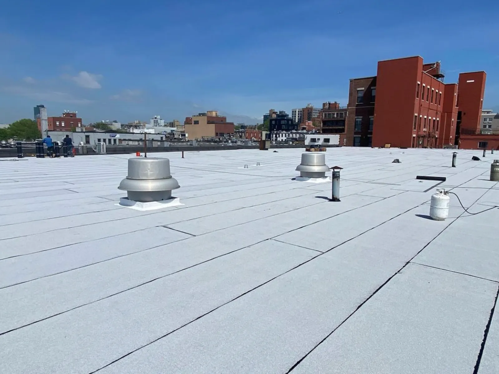 Flat roof over a city block, commercial by Skyline Construction Group