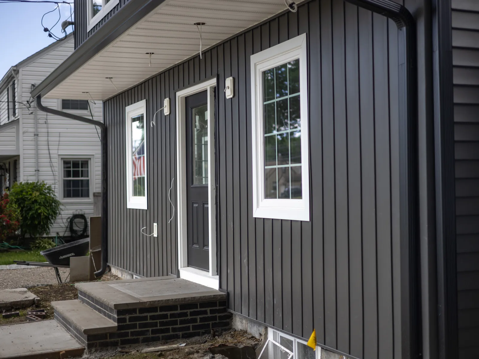 Siding and entry detail, siding by Skyline Construction Group