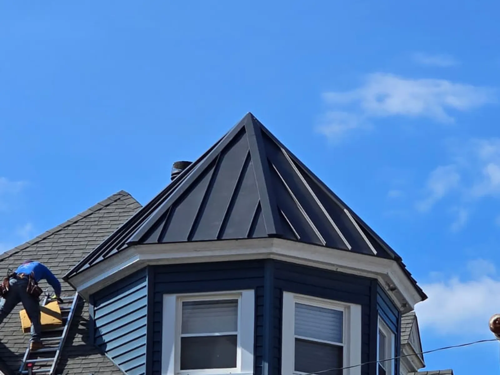 Turret roof in standing seam, metal roofing by Skyline Construction Group