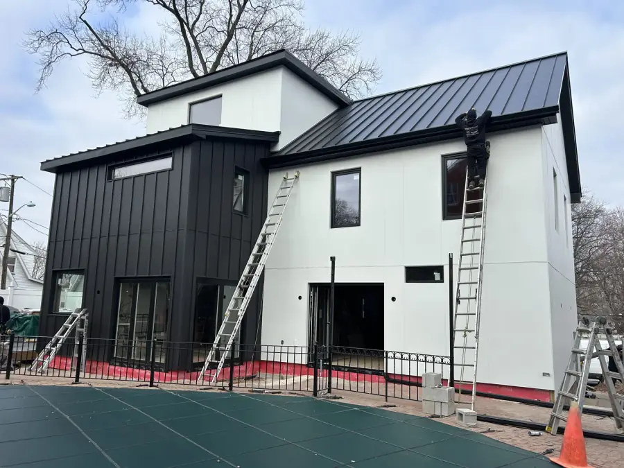 Standing seam over a modern build, exterior by Skyline Construction Group